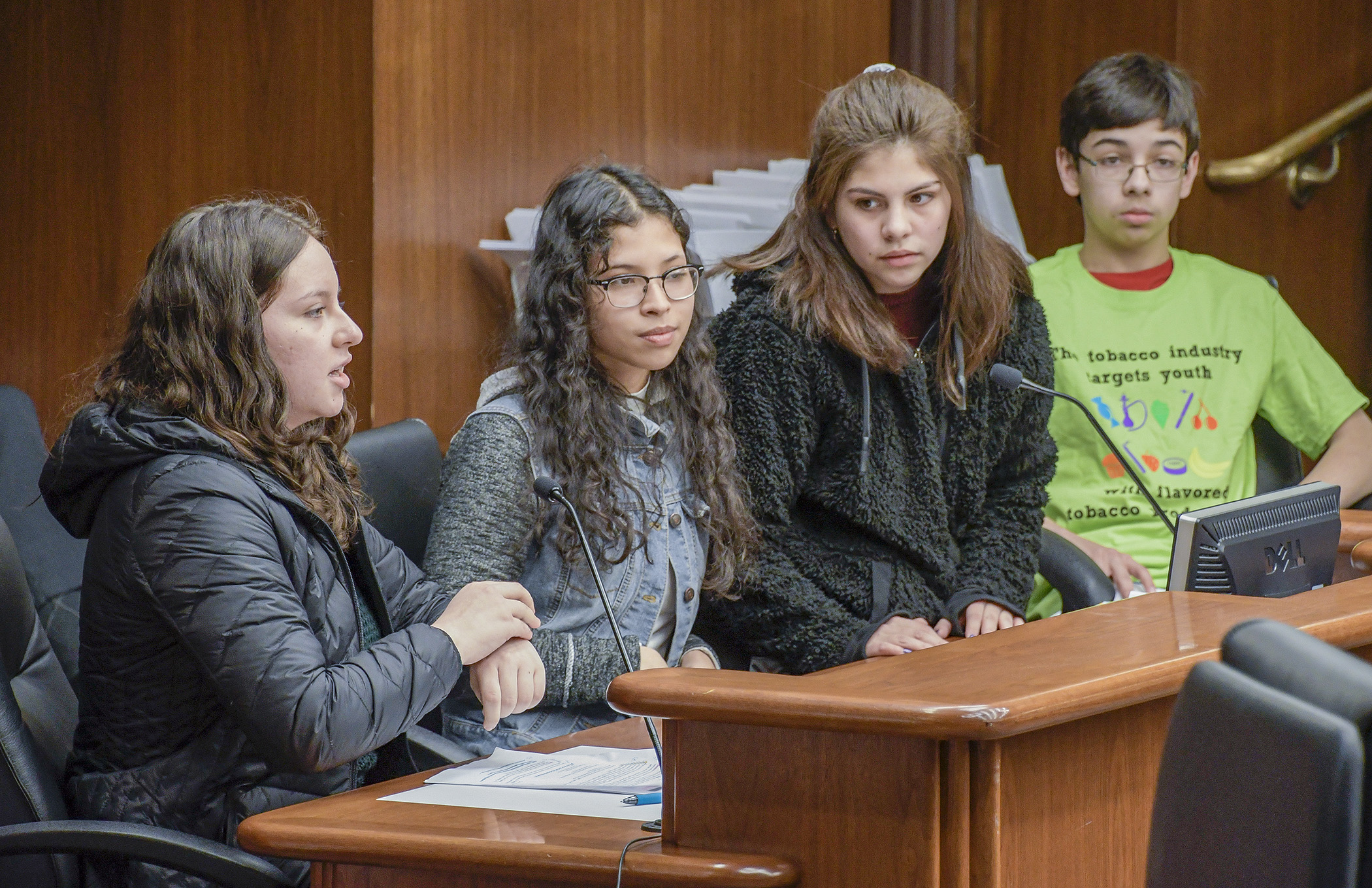 Henry Sibley High School students Britney Meza, from left, Diane Cruz, Gabriela Jacobs and Brandon Hanson testify before the House Health and Human Services Policy Committee Feb. 26 in support of HF3032. Photo by Andrew VonBank